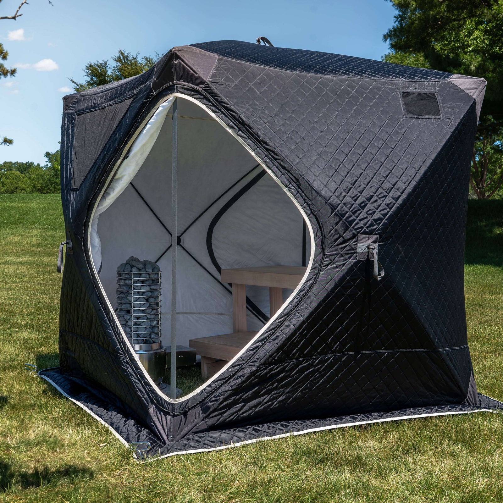 SaunaLife TITAN SL1 Portable Propane Sauna Heater inside a spacious portable sauna tent with stone heater.