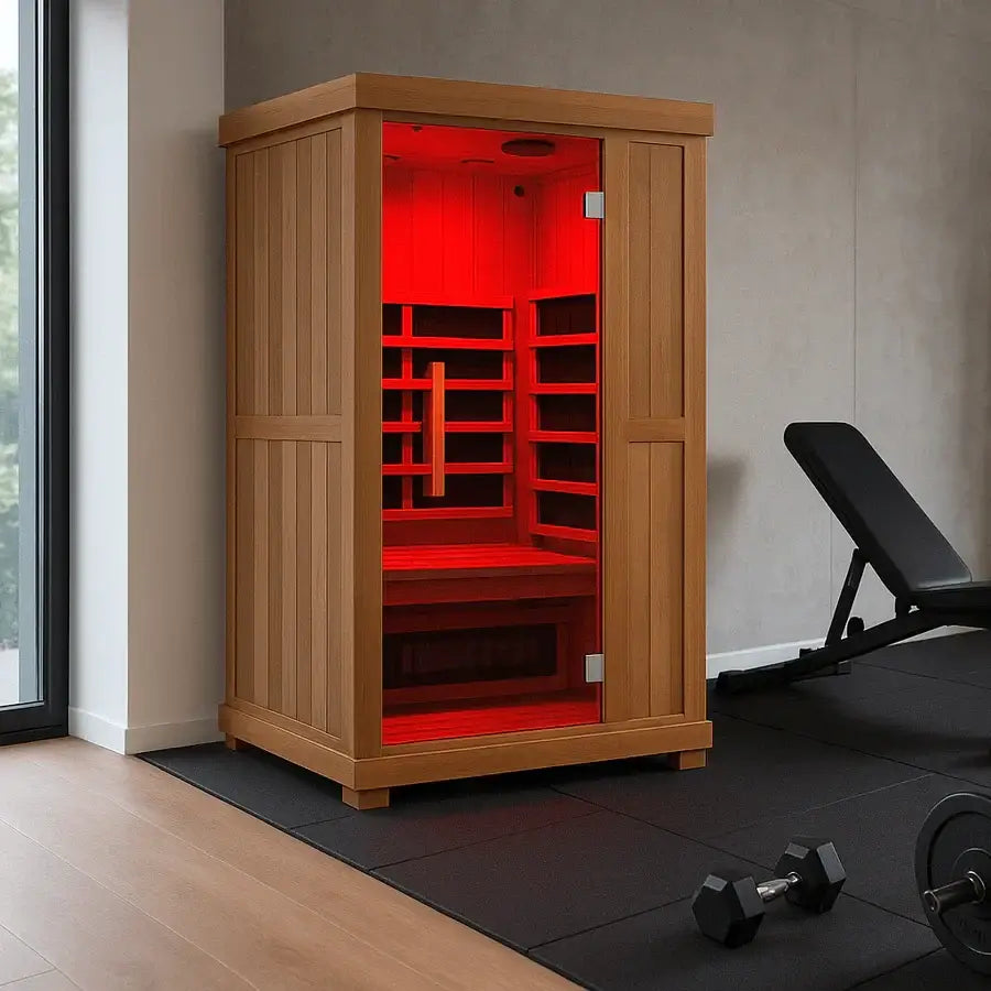 Wooden Finnmark FD-1 Full Spectrum 1-Person Infrared Sauna FD-KN001 with red interior in a room with gym equipment
