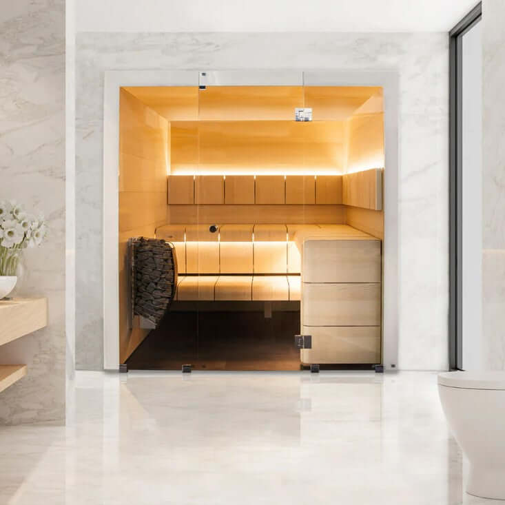 Modern sauna with wooden interior, Harvia Spirit electric sauna heater mounted on it's wall, and LED lighting, in a marble-walled room.