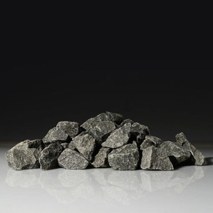 Pile of Harvia gray stones on a reflective surface with a black background