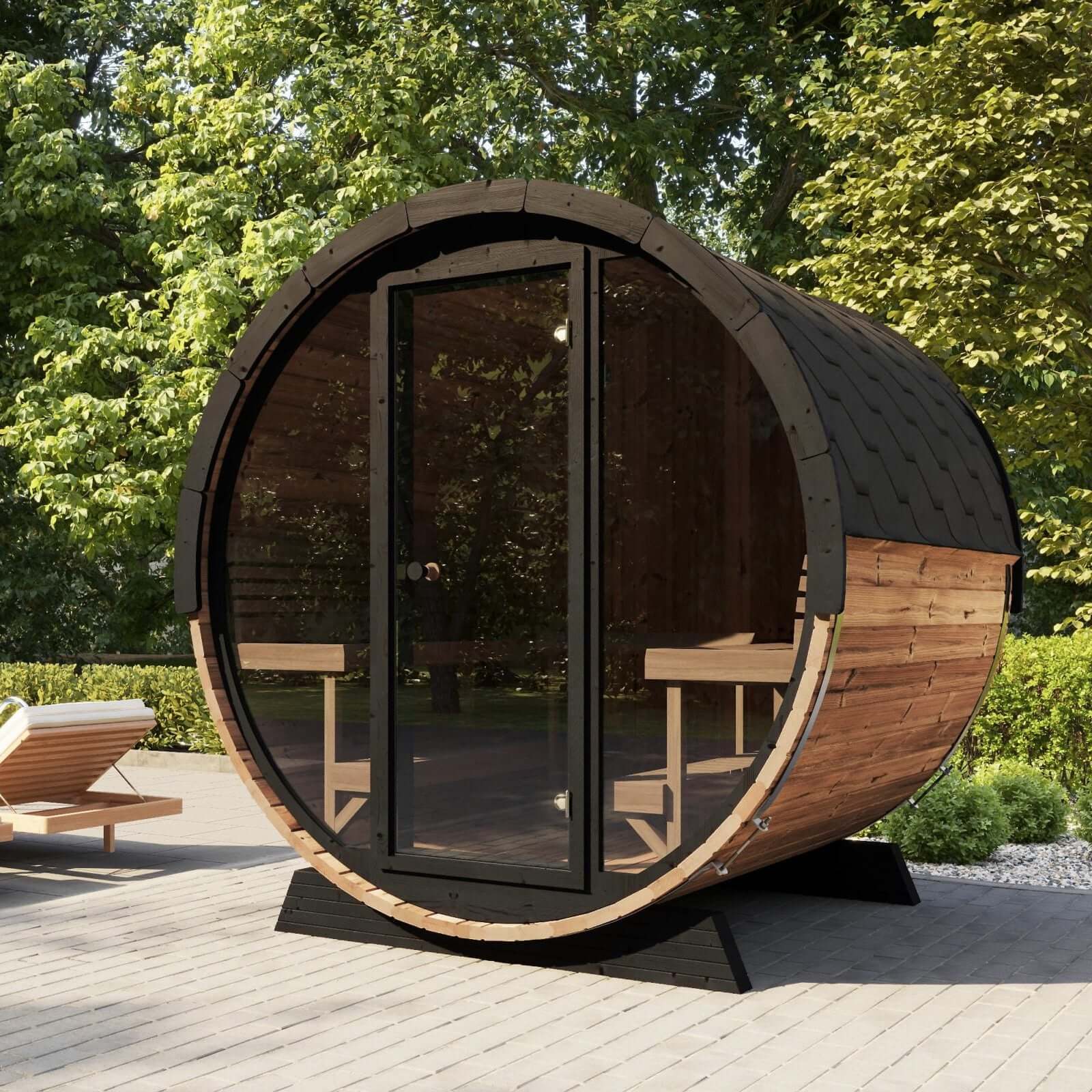 A four-person barrel sauna from SaunaLife, model EE8G, featuring a large glass door and wooden seating, set outdoors on a sunny day.