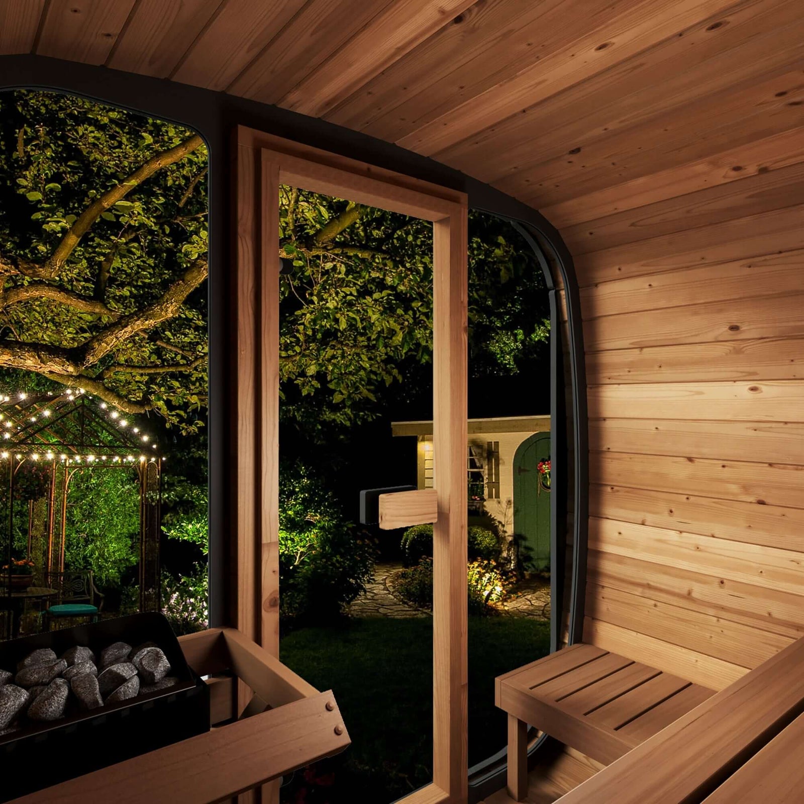 "SaunaLife CL5G Outdoor Sauna with contoured seating and garden view at night"