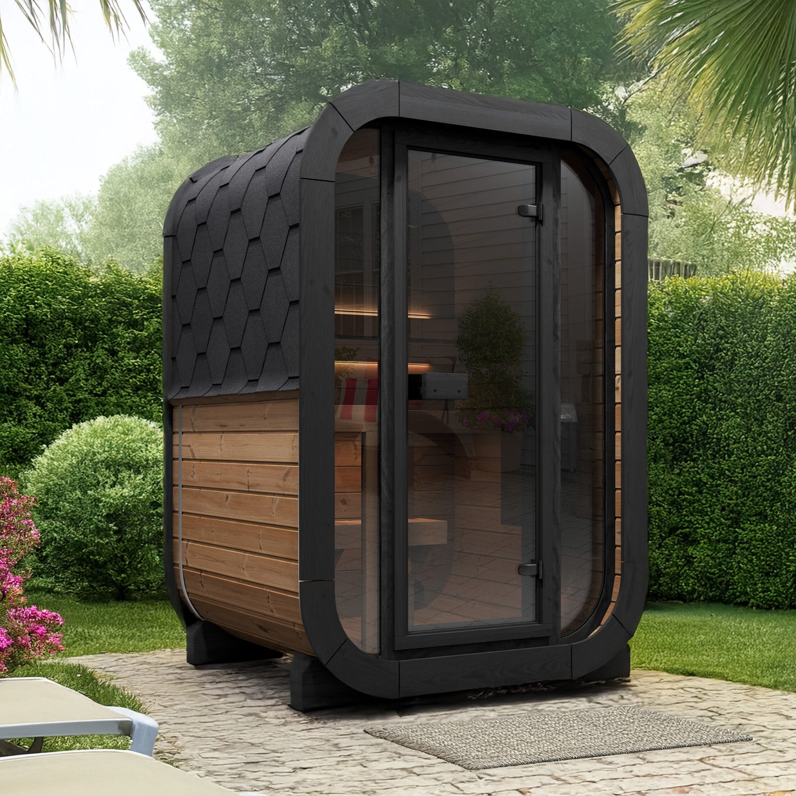 Modern outdoor SaunaLife CL3G sauna pod with glass front wall in a garden setting.