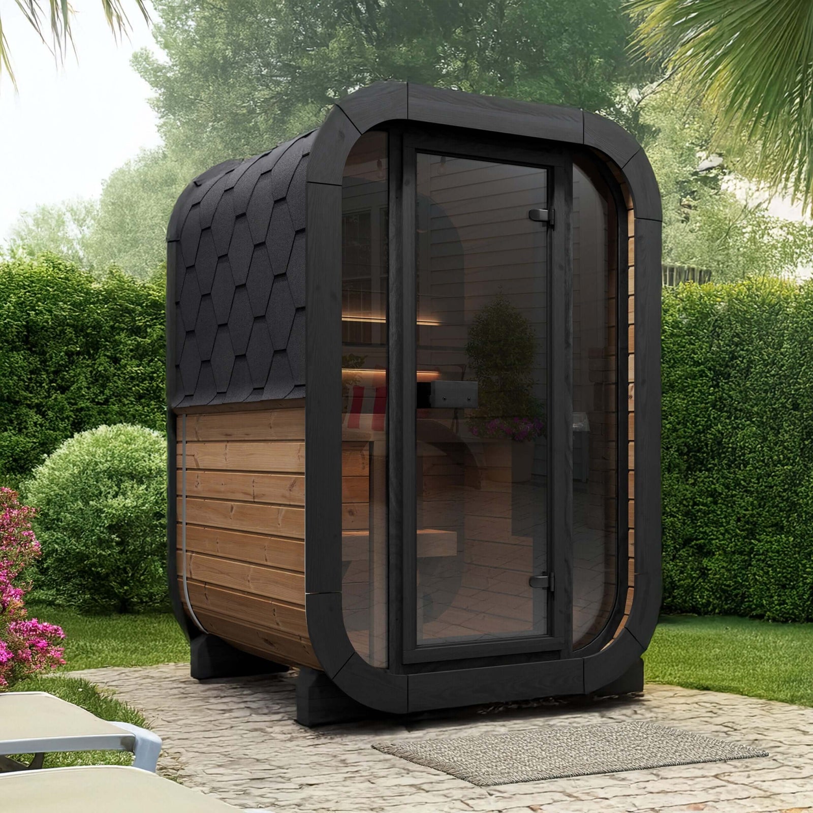 Modern outdoor SaunaLife CL3G sauna pod with glass front wall in a garden setting.