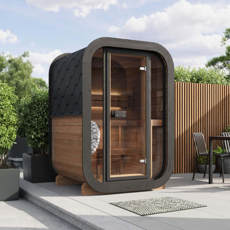 SaunaLife CL3G outdoor sauna kit featuring modern design and tempered glass front in a backyard setting.