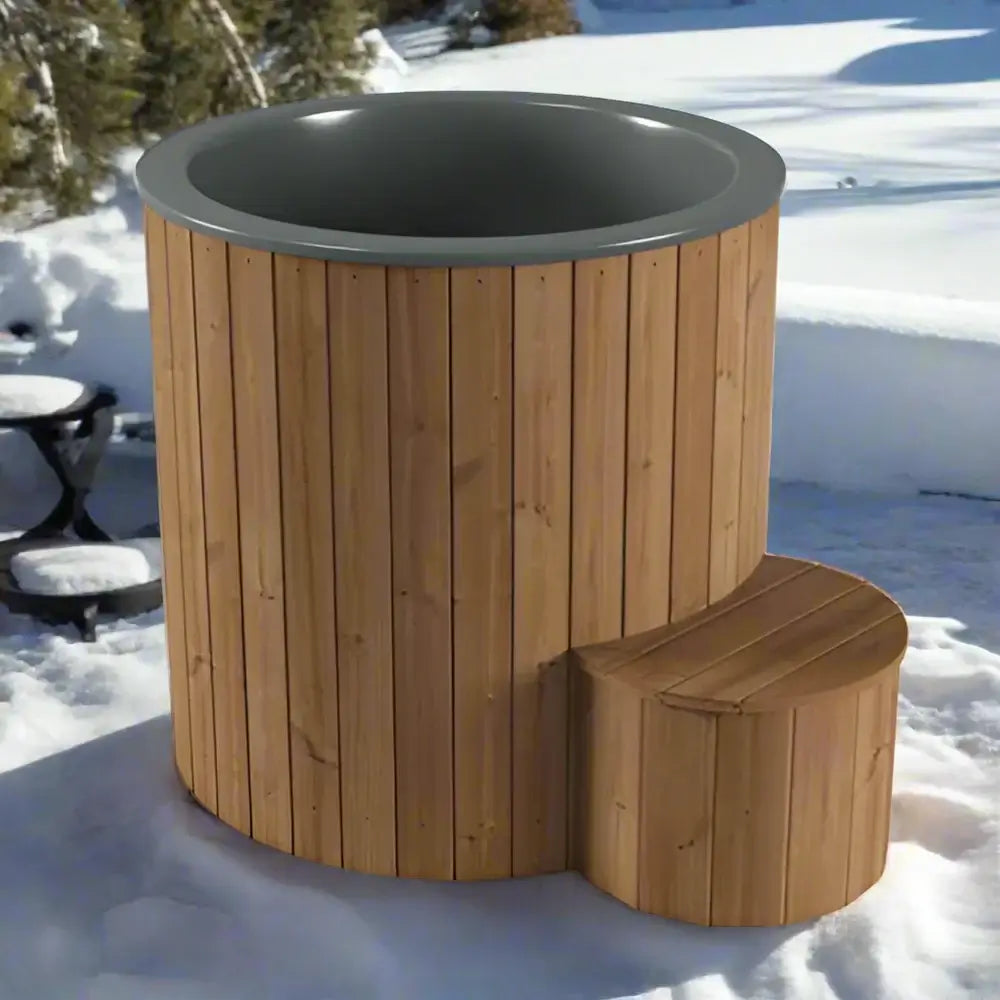 Wooden SaunaLife S1N hot tub with a dark interior in a snowy outdoor setting