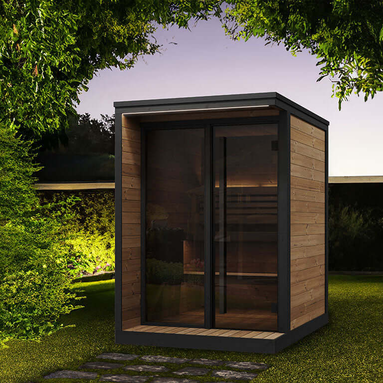 SaunaLife GL4, a luxurious wooden outdoor sauna cabin with a large glass door and glass window in a garden setting.