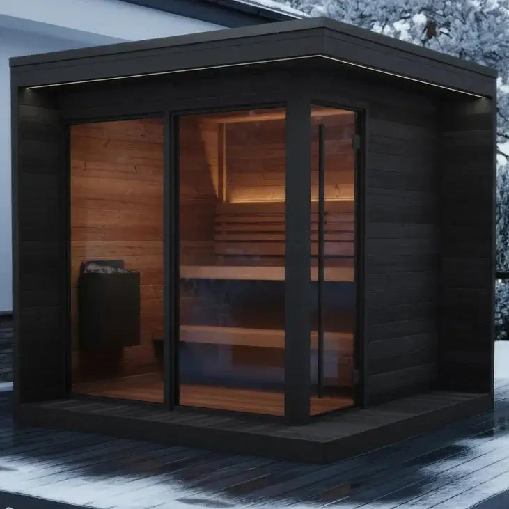 The GL6 modern outdoor sauna cabin, from SaunaLife, with dark wood exterior and warm wood interior, shown on a snowy patio in front of a house in winter.