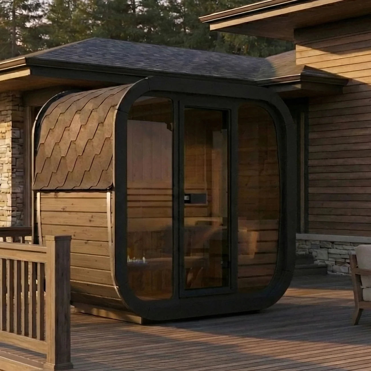 SaunaLife's CL4GB modern wooden outdoor sauna cabin with a glass doors, large windows and a curved black frame, situated on a wooden deck beside a house.