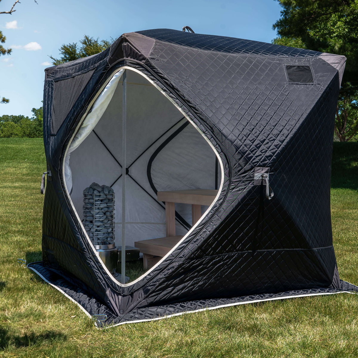 SaunaLife TITAN SL1 Portable Propane Sauna Heater inside a spacious portable sauna tent with stone heater.