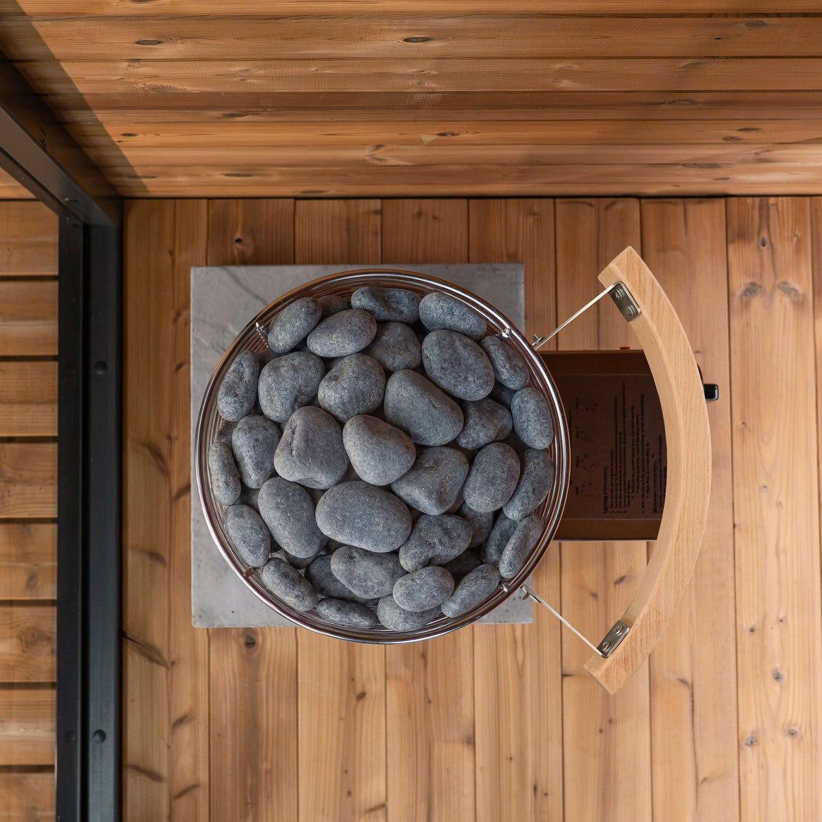 Top view of stones in a sauna, designed for SaunaLife TITAN SL1 Portable Propane Sauna Heater.