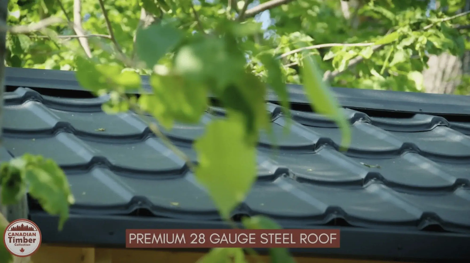 Premium 28 gauge steel roof of Dundalk Leisurecraft Georgian Cabin Sauna with changeroom amidst green leaves. CTC88CW