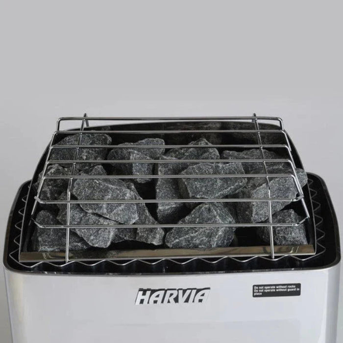 Harvia KIP sauna heater with rocks on a gray background.