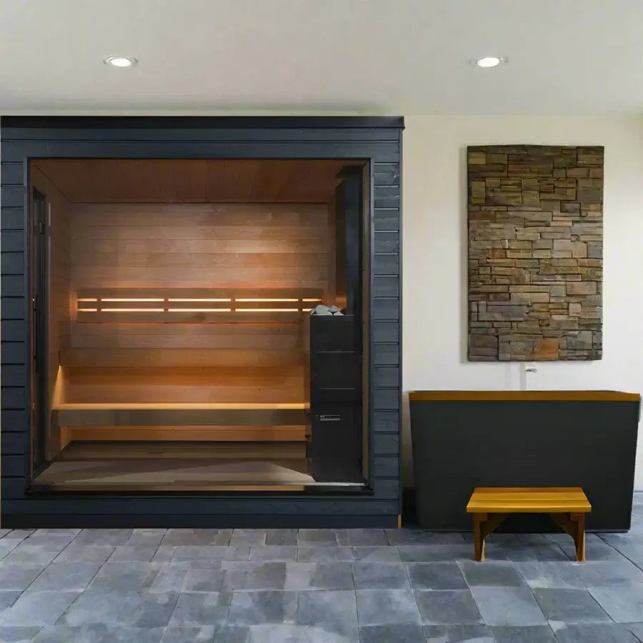 Modern SaunaLife G6 indoor sauna with wooden bench, cold plunge and stone wall art on a light gray floor.