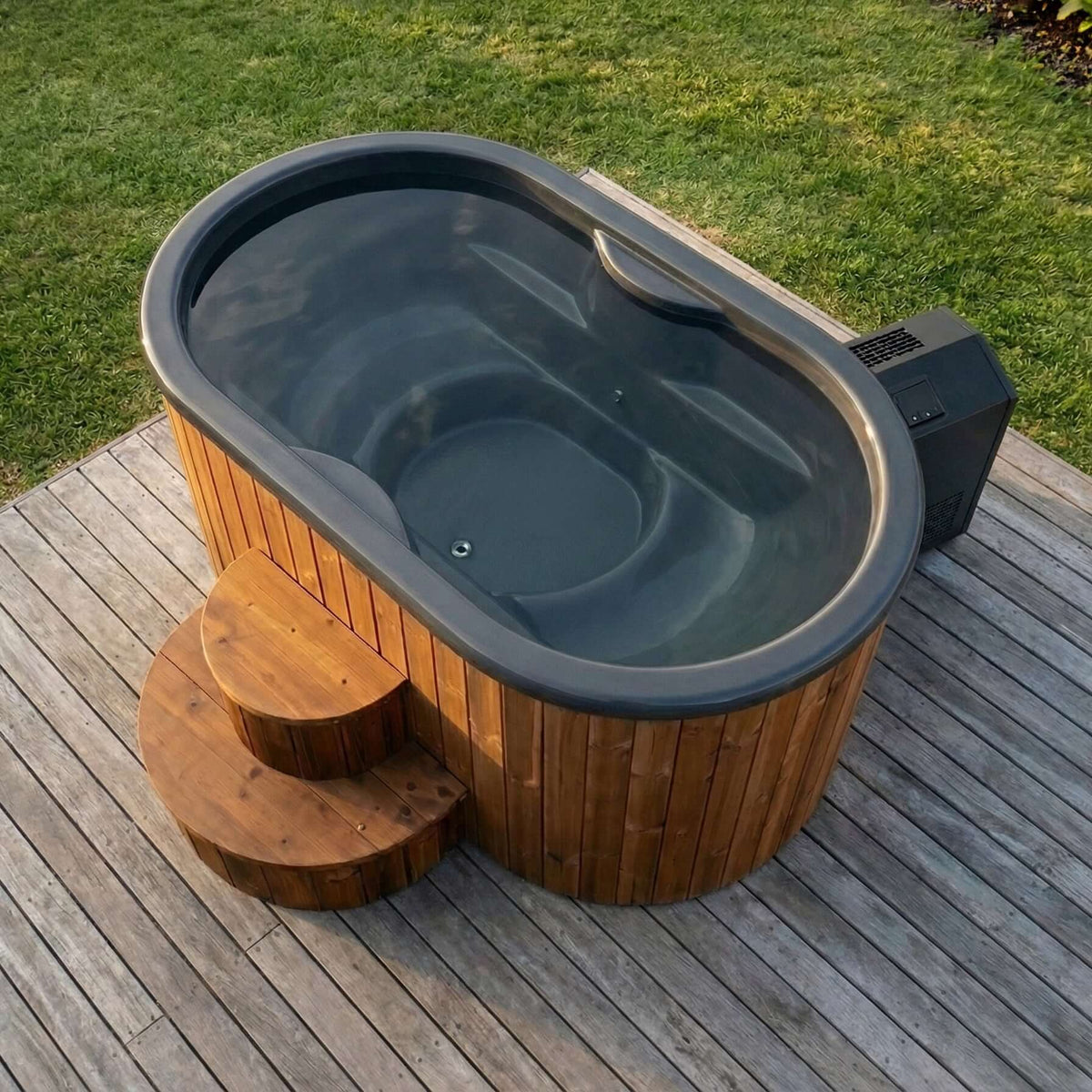 SaunaLife S2N plunge tub on a wooden deck with grass in the background