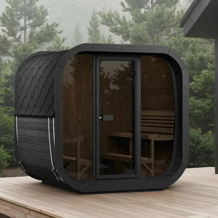 The CL7GB, SaunaLife's modern outdoor sauna cabin with a black textured exterior, glass door and windows, set on a wooden deck with a misty forest background.